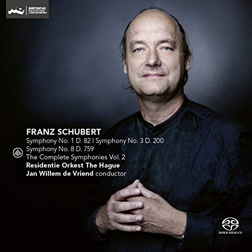 "CD cover featuring a man in a dark shirt with clasped hands."