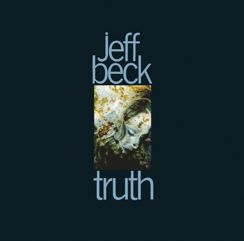 "Album cover for Jeff Beck's 'Truth' with a woman's portrait on a black background."