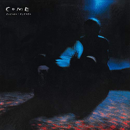 CD cover for Come’s “Eleven:Eleven” featuring a person in blue and dark tones.