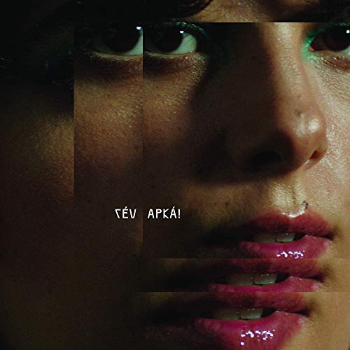 A close-up of a woman's face with glossy lips and the text "TÉV APKÁ!".