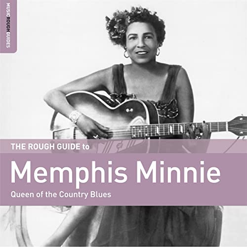 Black and white portrait of Memphis Minnie with her acoustic guitar.