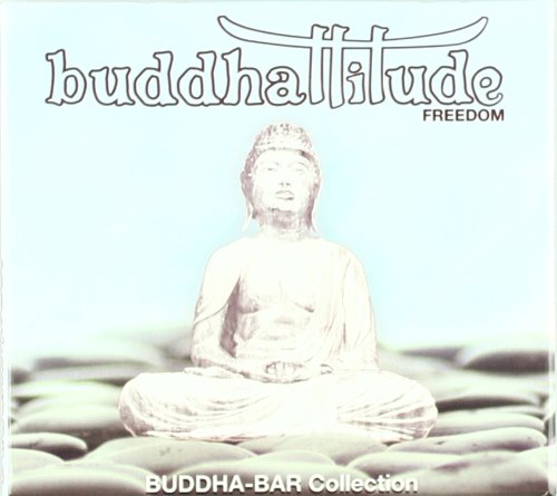 White Buddha statue sits cross-legged on lotus flowers against a blue background.