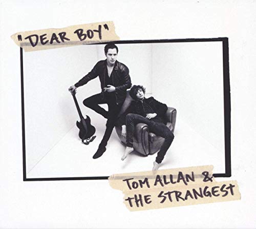 Black and white vinyl album cover with two men in dark clothing posing indoors.