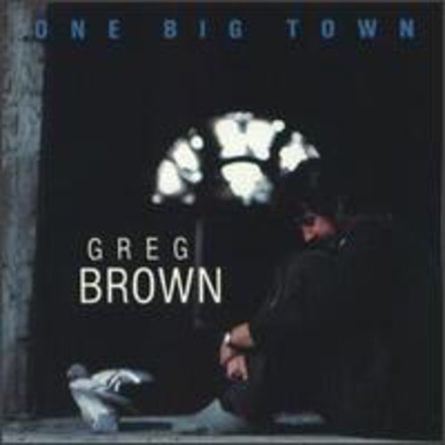 "Album cover with man sitting on ground, pigeon nearby, under a streetlight."