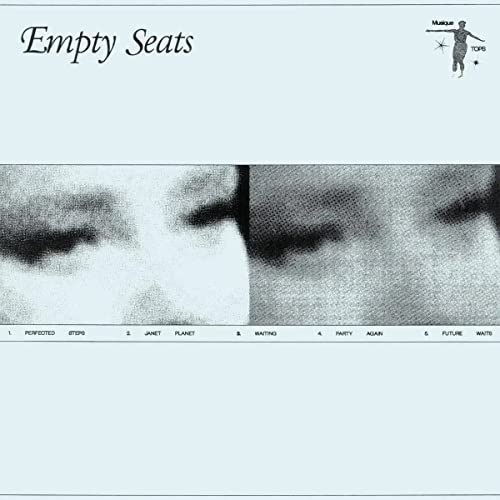 “Empty Seats” vinyl album cover with blurred, close-up eye images.