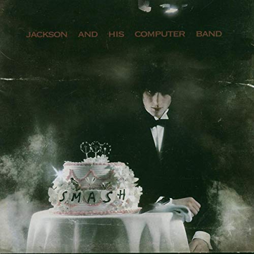 Album cover for “Smash” by Jackson and His Computer Band, featuring a man and cake.