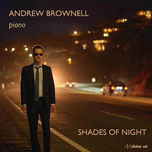 Andrew Brownell album cover: man in suit, city lights, piano music.