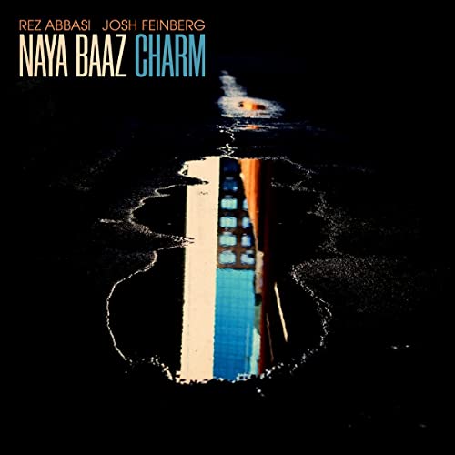 CD cover for "Naya Baaz Charm" featuring a piano reflection in water.