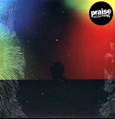 Album cover with colorful, blurred background and silhouetted figure.