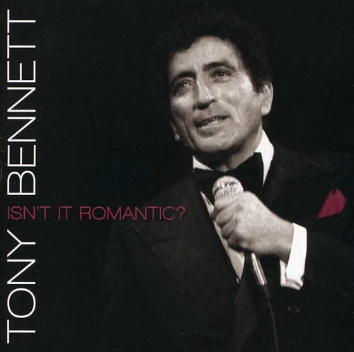 Tony Bennett in a tuxedo holding a microphone, album cover.
