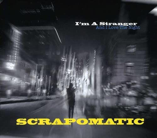 CD cover: blurry nighttime city street with text "Scrapomatic" and "I'm A Stranger".