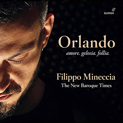 CD cover featuring a close-up of a man’s face and golden text.