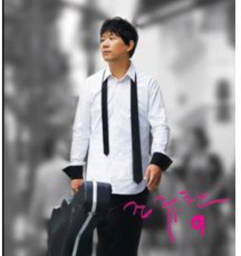 Man in white shirt and tie holding a guitar case.