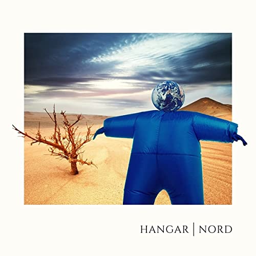 Blue figure with a globe head stands in a desert landscape.