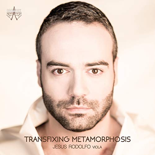 Man with short dark hair and beard, wearing white shirt, album cover.
