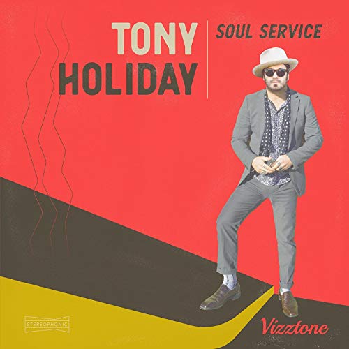 Album cover featuring a man in a grey suit and white hat against a red background.