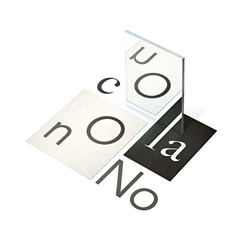 "Vinyl record packaging with cards displaying 'no' and 'co la' on white and black backgrounds."