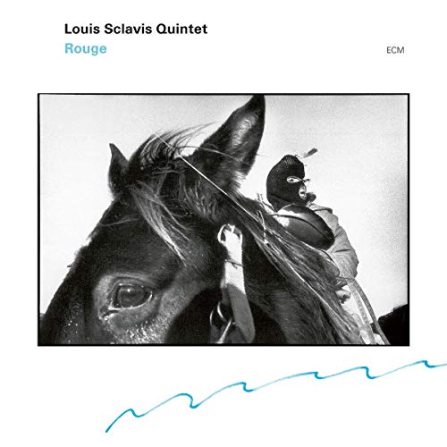 "Album cover featuring black and white image of a horse and masked rider."