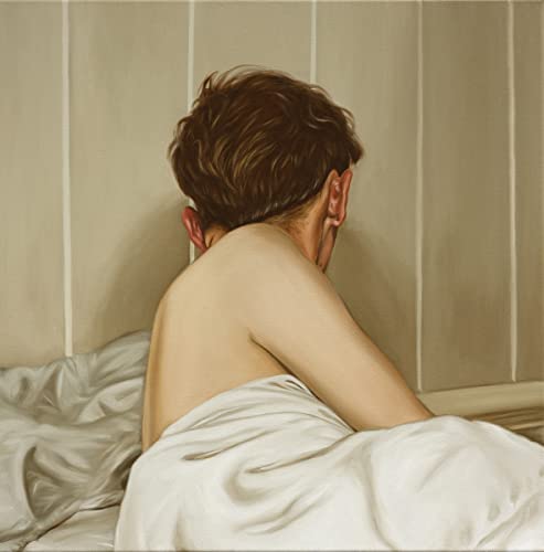 Back of a person with short hair, lying under a white sheet.
