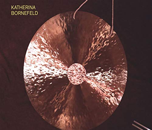 CD cover featuring a large, struck bronze gong with radiating light.