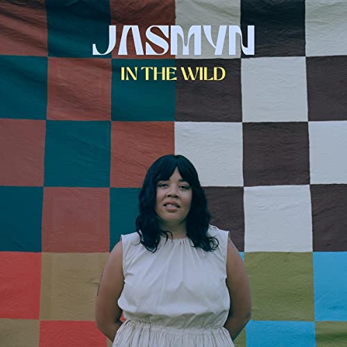 Album cover for Jasmyn’s “In The Wild” featuring a portrait of the artist.
