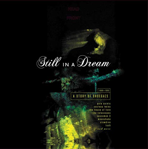 "Album cover with 'Still In A Dream' title on a dark background."