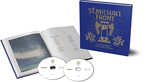 Blue CD case with winged hourglass symbol, open booklet, and two discs.