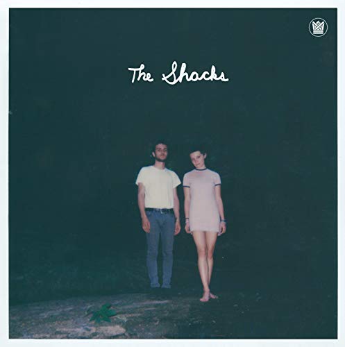 CD cover for “The Shacks” featuring a man and woman against a dark background.