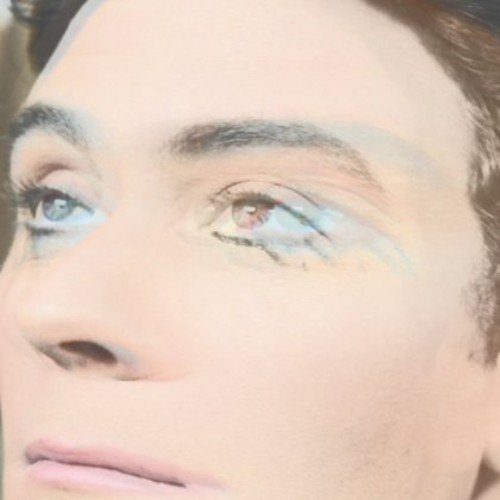 Close-up of a person’s face with painted eyes, album artwork.