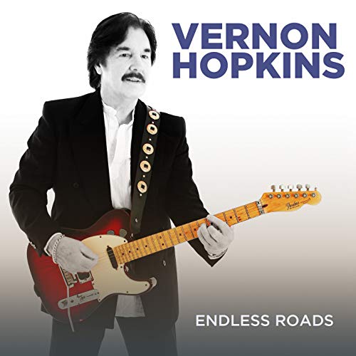 Album cover featuring Vernon Hopkins holding a red electric guitar, wearing a black suit.