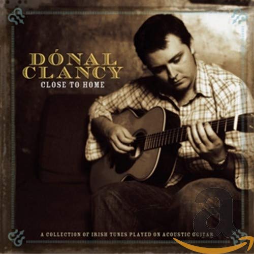 Donal Clancy album cover: musician playing acoustic guitar, sepia tone.