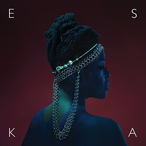 "Album cover featuring a dark-skinned woman with braided hair and silver headpiece."