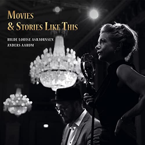 Black and white CD cover featuring a woman with a microphone and a man in a hat.
