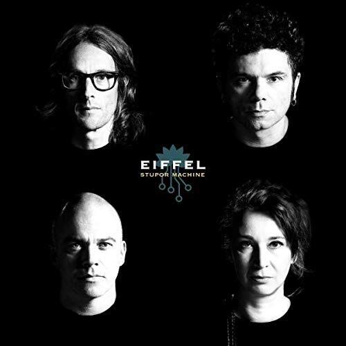 "Black and white image of four men against a black background with 'Eiffel Stupor Machine' text."