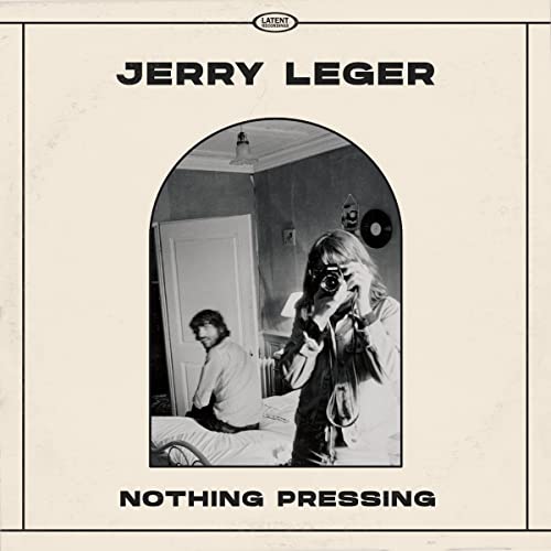 CD cover for Jerry Leger’s “Nothing Pressing” featuring a person with a camera.