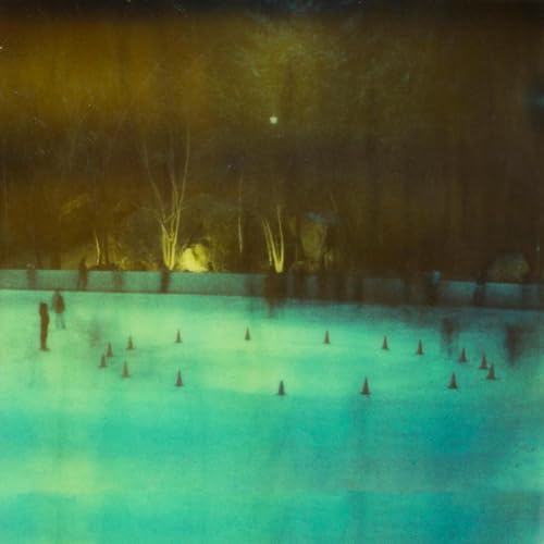 Blurred, abstract album cover with blue and gold marble effect, trees.