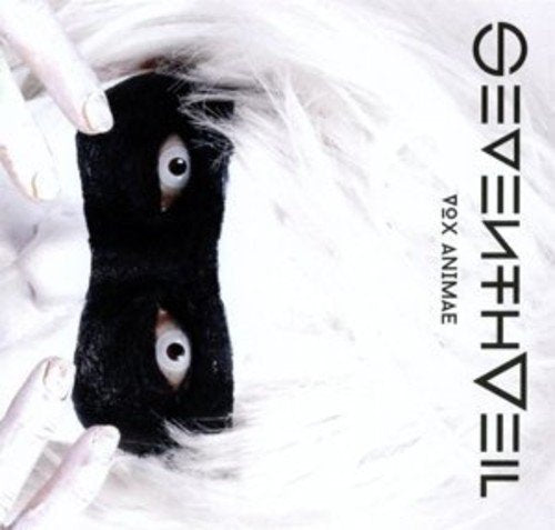 "Album cover with a white furry background and eyes peeking through black fabric."
