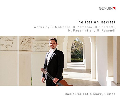 CD cover: man in tuxedo holding guitar, white architectural background, title and artist name.