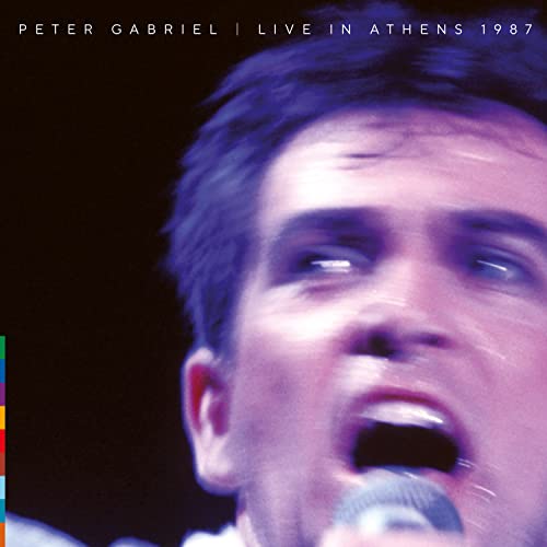 Peter Gabriel singing into a microphone, album cover for Live in Athens 1987.