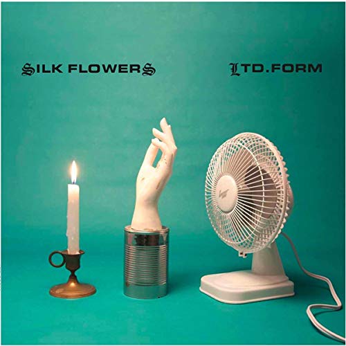 CD cover with a hand, candle, and fan on teal background.