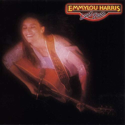 "Album cover featuring Emmylou Harris holding a guitar, with her name and title."