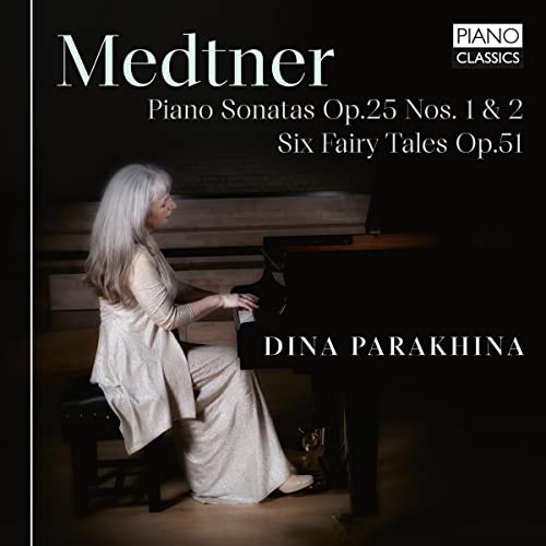 CD cover: Pianist Dina Parakhina at a grand piano, dark background.