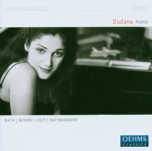 "CD cover with a black-and-white photo of a woman near a piano."