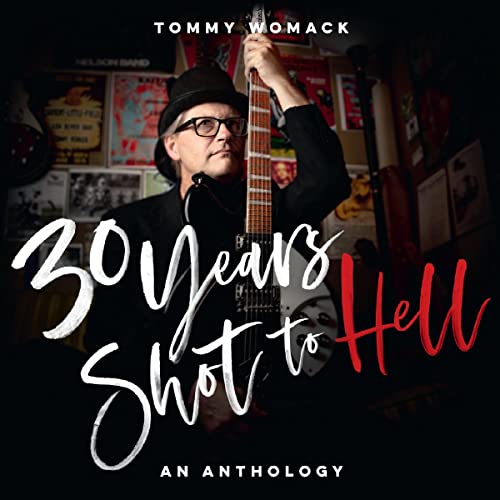 Tommy Womack poses with a guitar, album title “30 Years Shot to Hell.”