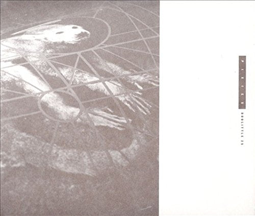 "Black and white album cover with geometric design and seal image, next to barcode."