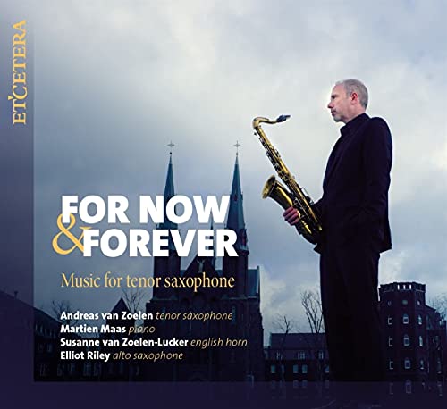 Man in black suit holds saxophone, against cloudy sky and church steeples.