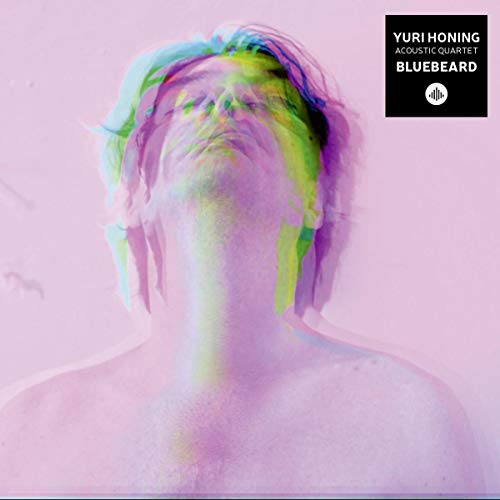 A pastel pink album cover featuring a distorted, multicolored image of a person's head and shoulders.