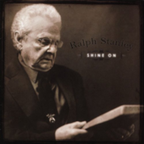 Sepia-toned CD cover featuring Ralph Stanley reading a book, with "Shine On" text.