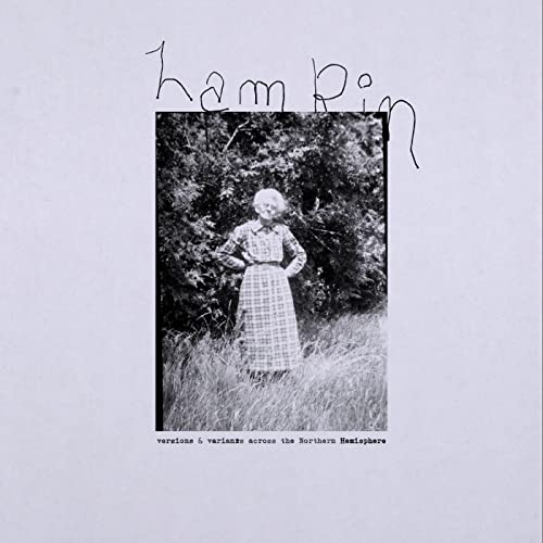 CD cover: black and white photo of a woman in a field.