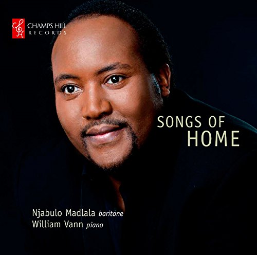 Album cover with a man's portrait and "Songs of Home" text on a black background.